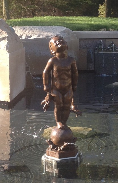 Frog Baby smiling in the glow of the sun.