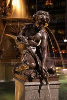 This is a close-up view of the boy playing with the snake. It signifies the pleasures of water.
