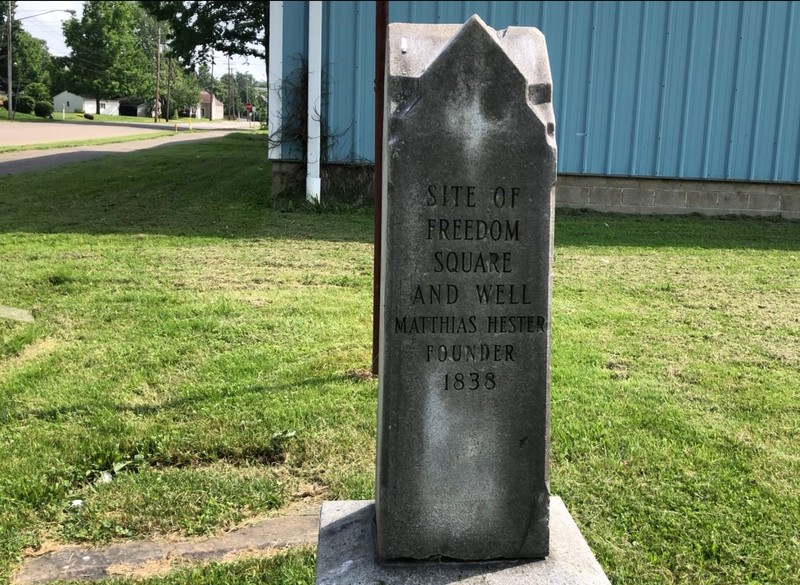 The marker on the southwest corner of Keystone Street and N. Park Avenue commemorates the Freedom village square. The village well can be seen beside the marker.