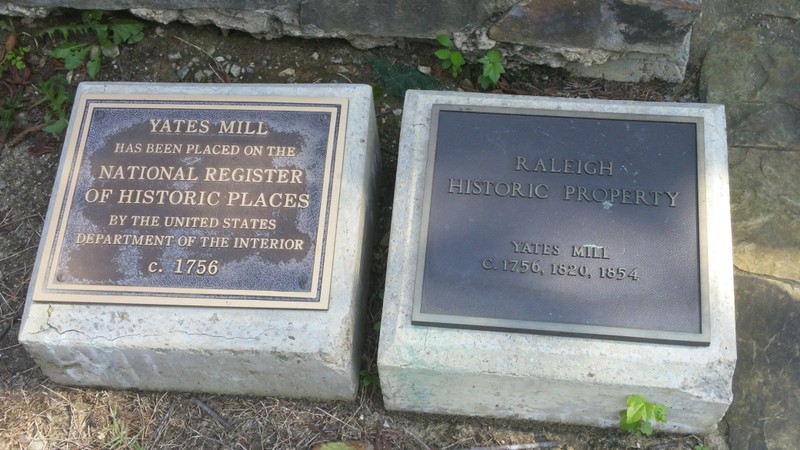 Plaques outside of the mill showing its adoption to the National Register of Historic Places.