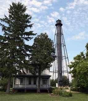 View of the light from Port Penn road. The house in the foreground is either the former keeper's house or his assistant's.
