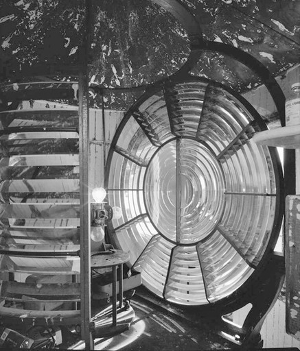 Interior view of watchroom with the fresnel lens and electrical lights visible