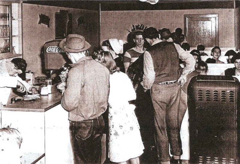 Young people inside the Malt Shop with Claude Murray behind the counter