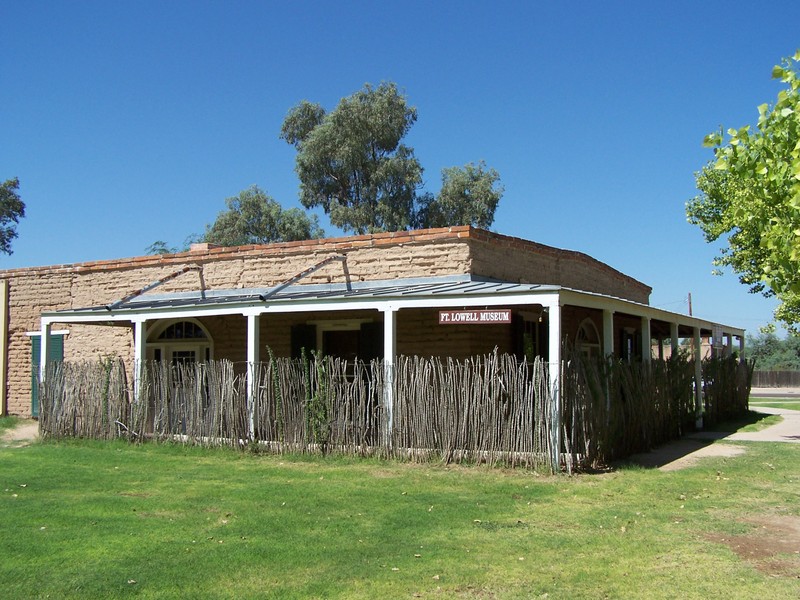 The Fort Lowell Museum is located within a historic park. Visitors to the museum view exhibits within a structure built to resemble the commanders quarters.