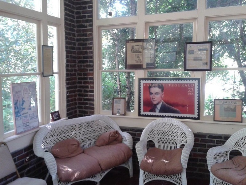 The sunroom of the Fitzgerald Museum, featuring some of the exhibits on display, including an enlarged stamp of Scott. Photo Courtesy: Gregory T. Janetka / Atlas Obscura