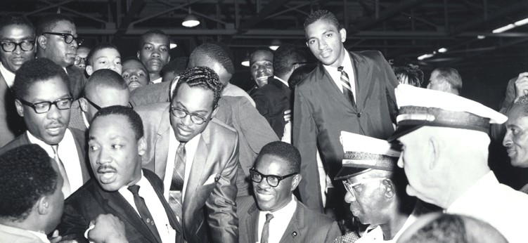 Reginald Hawkins (right) with Martin Luther King Jr. at Hartley-Woods Gymnasium, Johnson C. Smith University, Charlotte, 1966.