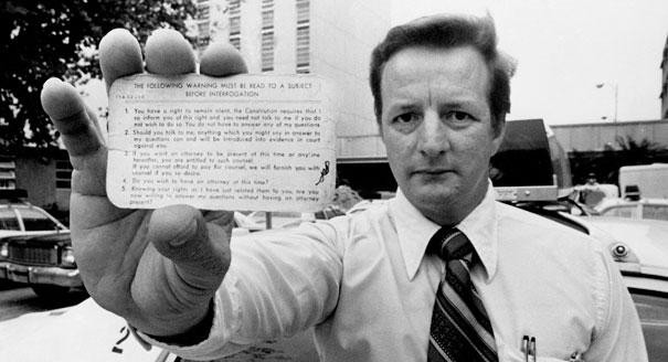 A gentleman holding newly issued "Miranda Rights" cards shortly after the 1966 Miranda v Arizona SCOTUS ruling. 