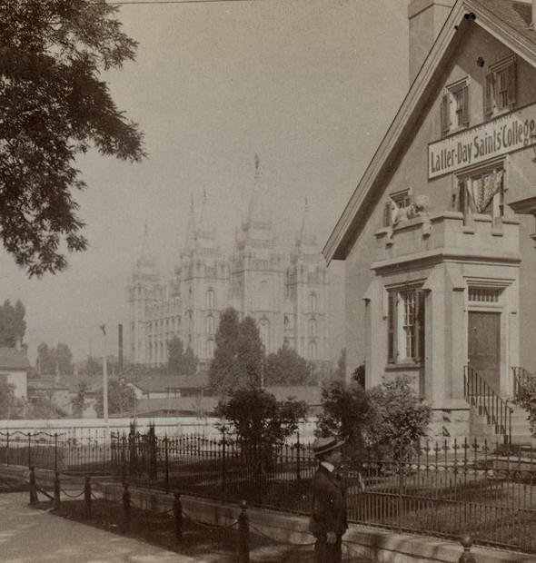 Lion House when it was being used by LDS University (Latter-Day Saints College). The Salt Lake Temple can be seen in the background because the Hotel Utah and Church Administration Building had not been built yet.