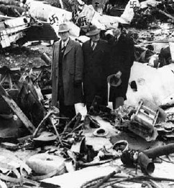 Apostle Ezra Taft Benson (and later 13th President of the LDS church) was assigned by George A. Smith to oversee the church's welfare efforts in Europe. Benson on the left and 2 counselors walk among debris in a European city.