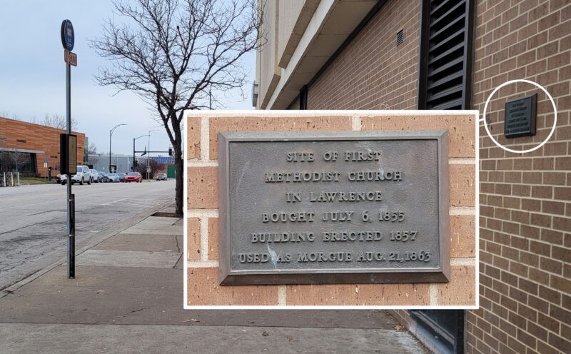 The former site of the First Methodist Church and the historic plaque noting the church's role during Quantrill's Raid.