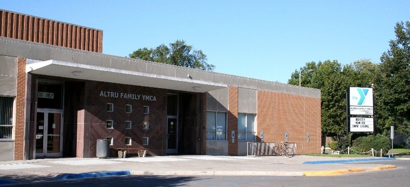 On a clear day the YMCA is shown off with trees in the background