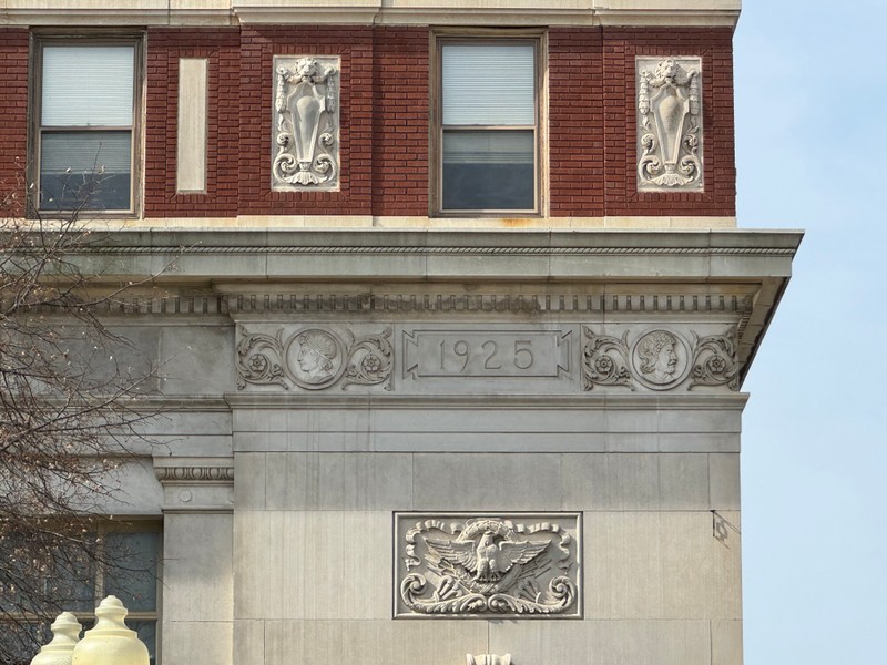 Detail of date and carvings in City Savings Bank Building