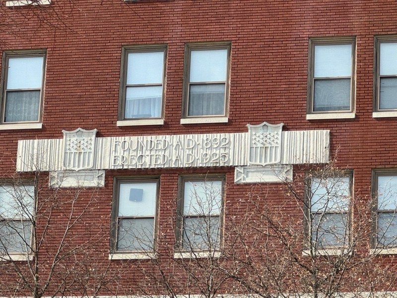 Detail of date and carvings in City Savings Bank Building