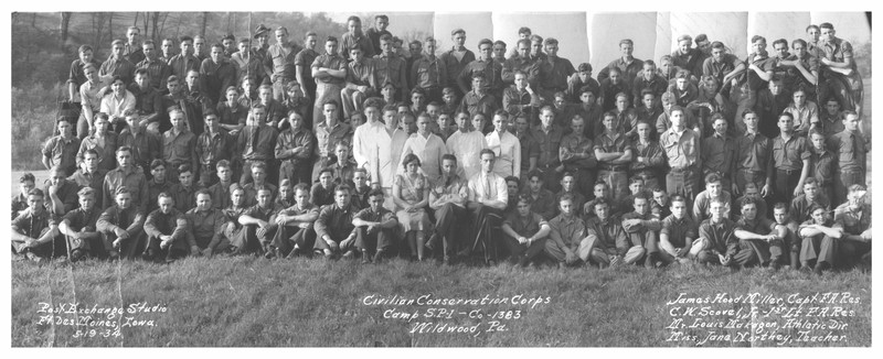 Black and white landscape photo, showing 138 men and one woman sitting or standing for a group portrait.