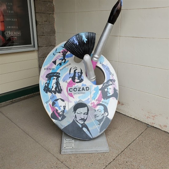 Painted by Kent Ross and Jaycie Grabenstein Located in front of the Fox Theater Kent Ross is a recently retired art instructor with 42 years of teaching experience. He is a graduate from the University of Nebraska-Kearney with a B.A. in Education and a Bachelor of Fine Arts degree. Kent declared, “Designing the icon was a great opportunity for me and my daughter Jaysie to work together designing public art.” Jaysie Grabenstein is a graphic designer living in Loveland, CO. She is from Cozad and a graduate of UNK where she earned a Bachelors of Fine Arts with an emphasis in Visual Communication and Design. Jaysie also recently obtained a B.A. in Art History from Arizona State University. When she’s not creating or studying art & culture, she enjoys mountain hiking with her husband and beagles.
