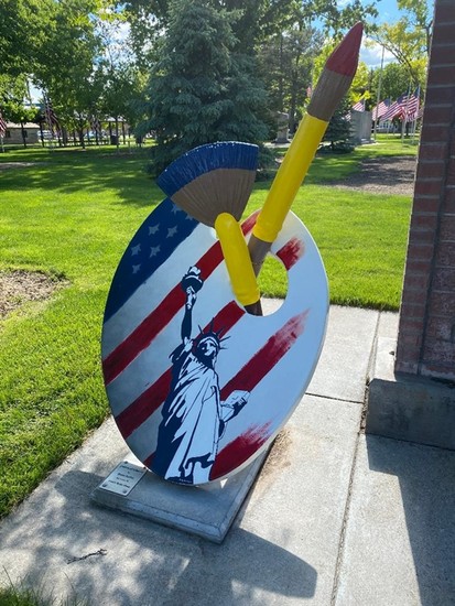 Painted by Doug Keller Located along east side of Veteran's Memorial Park/City Park Born on a farm east of Eustis 60 years ago, Doug Keller had dreams of a different life. Doug attained a degree in Auto Body Technology from Southeast Community College-Milford. Then he attended Kearney State College (now UNK) and graduated with a MBA. Today he is the proud owner and president of the six Eustis Body Shop stores located throughout the state and of Eustis Mechanic Shop. Doug married his wife Deb, a school psychologist, in 1983 and together they had three children: Austin, Brianne, and Adam. Doug said of his icon, “Colors of Liberty comes from the inspiration of knowing we live in the best country in the world and our freedoms and individual rights are to be upheld at all cost. Life, liberty, the pursuit of happiness, and faith in God is paramount in our family’s lives.”