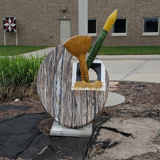 Painted by Addy Hergenrader Located in front of Cozad Middle School Addy Hergenrader is currently a Cozad High School senior. She enjoys a diverse variety of art media including drawing, painting, 3-D, and textiles. Her icon artwork was inspired by the agricultural industry around Cozad. Addy added, “Being able to participate in this project allowed me to expand my knowledge of art and its connection to the community. I am thankful for the opportunity granted to me to be able to paint an icon on behalf of Security First Bank."