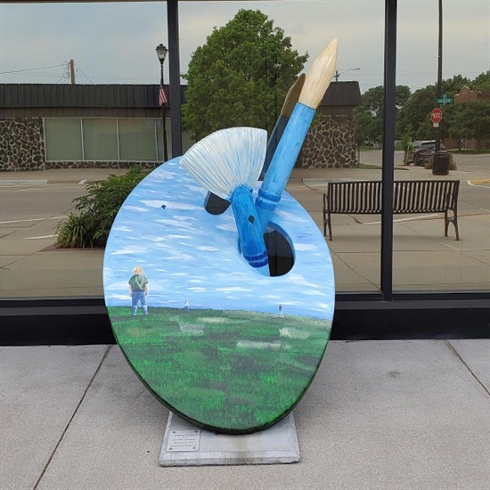 Painted by Aimee L Erickson Located in front of Central Plains Home Health Aimee Erickson is known for a whimsical style that transforms simple items into large installations. From the elegance of painting a few figures flying kites to a massive waterfall made from scrap cardboard and linen; Aimee loves to respond to the visual stimulations from her life. She currently lives in Lincoln, NE with her husband, three boys, and dog. After graduating from UNL, she continued to explore her passions in photography, painting, mixed mediums, and sculpture. Aimee is always searching for places to grow and make an impact. No matter where she goes, Aimee surrenders her work to God, the creator of everything, and she encourages others to create new art in response to the work she does.