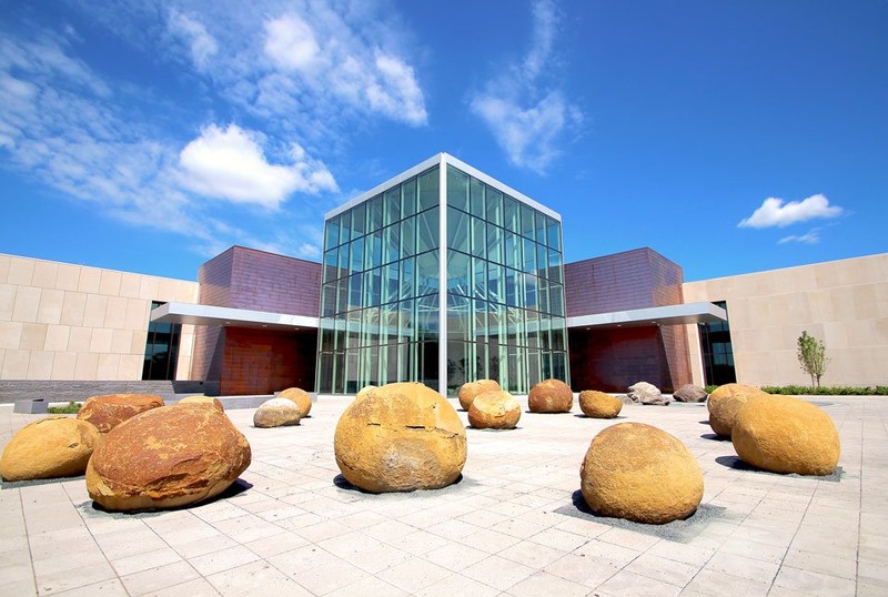 The North Dakota Heritage Center & State Museum is the state's main history museum. This photo shows the plaza in front of the new atrium. The large boulders in the foreground are 56 million years old. 