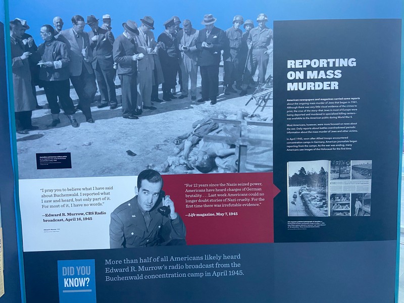 A black and white images of journalist and American military police on an inspection tour of the Buchenwald concentration camp, 1945.