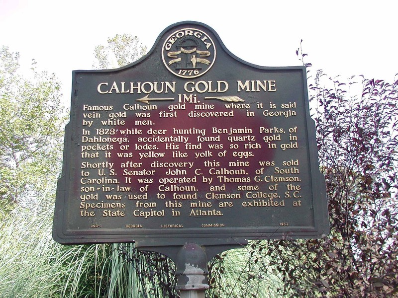 The historical marker for the Calhoun Gold Mine is located a mile from the former mine at the intersection of Calhoun Mine Road and the highway.