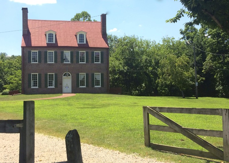 The Federal style Barclay Farmhouse sits within a 32-acre living history museum.  