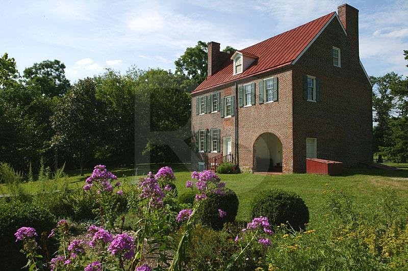 Flowers bloom behind the Barclay Farmhouse.  