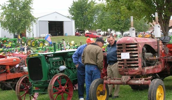 Visitors look at an old tractor at during one of the museum's annual Steam Show and Fall Festival Days. 