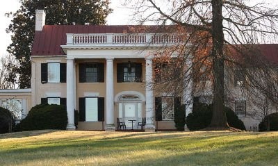 This front facing photograph captures the beauty of the front facade as well as the grounds.