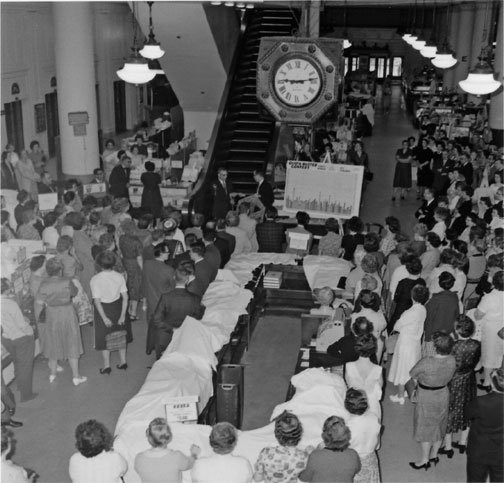 1960s photo of the interior of Boston Store employees preparing for Christmas season