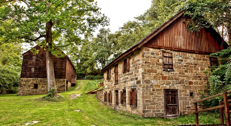 Distillery with grist mill in the background.