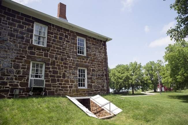 The cellar doors at the Hitchcock House in Lewis, in western Iowa, were used by escaped slaves on the Underground Railroad to access the basement and hidden room. The house was built in 1856 by the Rev. George Hitchcock.