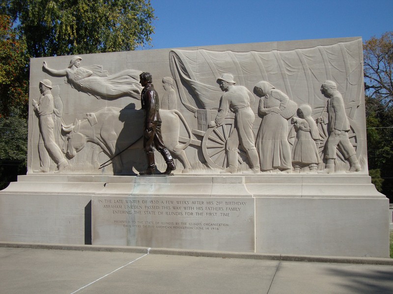 The memorial, with Lincoln standing in front of the relief.