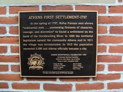 This plaque was dedicated in 1997 and is located to the left of the main door to the Athens City Building. 