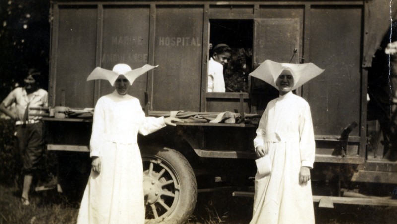 The Daughters of Charity, the first nurses at the hospital, arrived to care for the patients in 1896. Here they are pictured with two young patients. Photo 1930s.