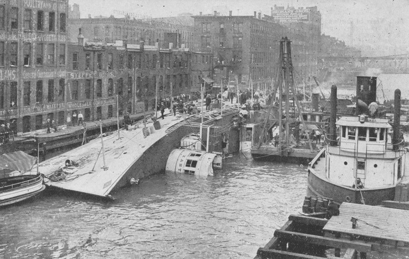 Picture of the Eastland resting on its side in the Chicago River