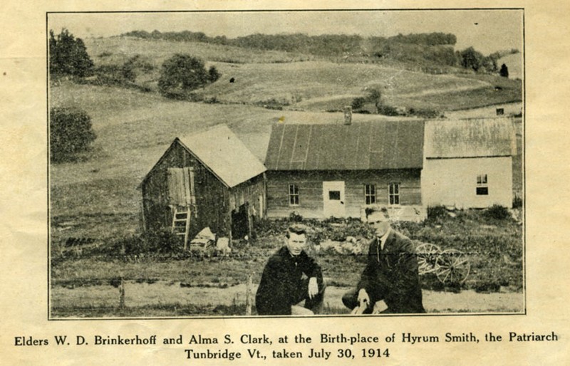 1914 photo of two LDS at the spot where Hyrum and Samuel Smith were born. Buildings in back are not of the original Smith farm, but built by the current occupants of the land at the time