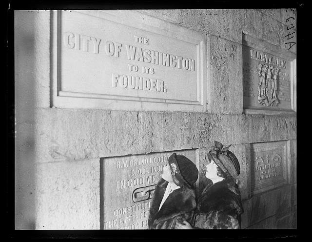 Visitors examine the City of Washington's memorial stone in the Washington Monument. Photo circa 1922, courtesy of the Library of Congress. 