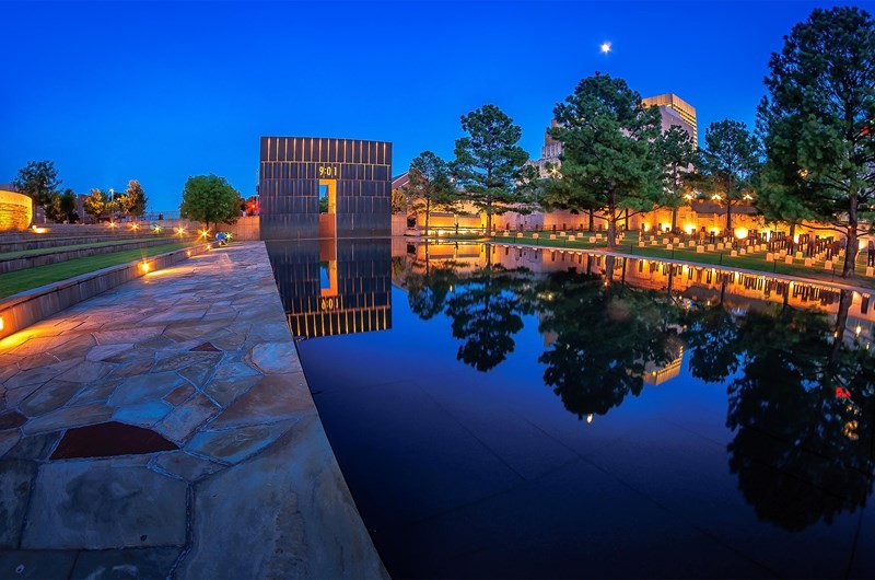 The Oklahoma City National Memorial at night. The memorial serves as a beacon of hope for survivors and those affected by the bombing. (Courtesy of adventureroad.com)