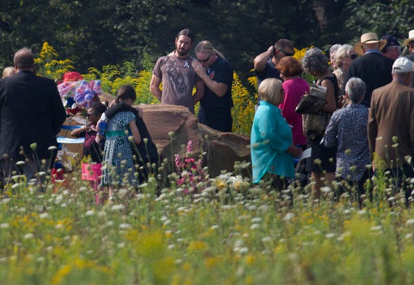 Family members of the passengers gather around the exact location where their loved ones died. They are the only people permitted to stand on the crash site.