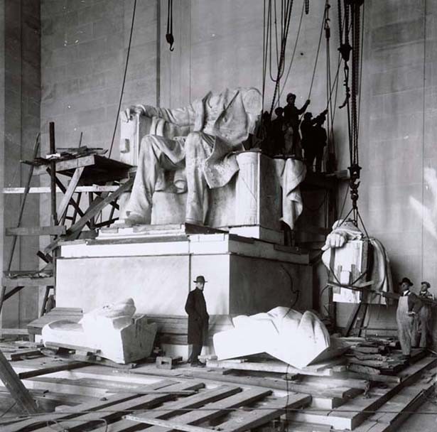 The Piccirilli Brothers, who carved the statue under the guidance of architect Daniel Chester French, stand at the unfinished statue of President Lincoln. 