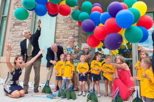 Museum Education, Heather Harris (far left, seated), and others release balloons in celebration of the museum's grand opening in the fall of 2015. 