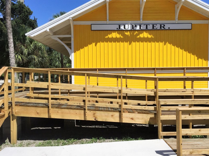 The Jupiter train depot is one of the few remaining wood frame stations built by the Florida East Coast Railroad.
Many of its depots were built from the same building plans and are only distinguishable by the large signs facing down the tracks. The f