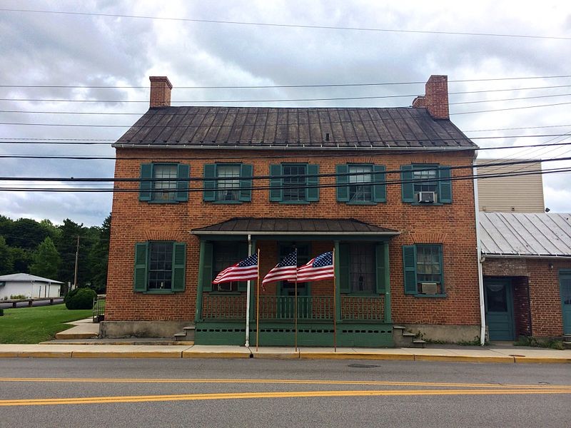 Kerns House (also known as the American Legion Hampshire Post No. 91 Building) is a late 18th-century residential and commercial building at 154 East Main Street in Romney, West Virginia, United States. United States flags flying in front of the Kerns House on the thirteenth anniversary of the September 11, 2001 attacks. Photographed by Justin A. Wilcox of Washington, D.C.