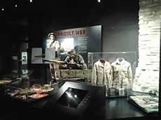 Museum exhibits include battle flags, uniforms, and weaponry.