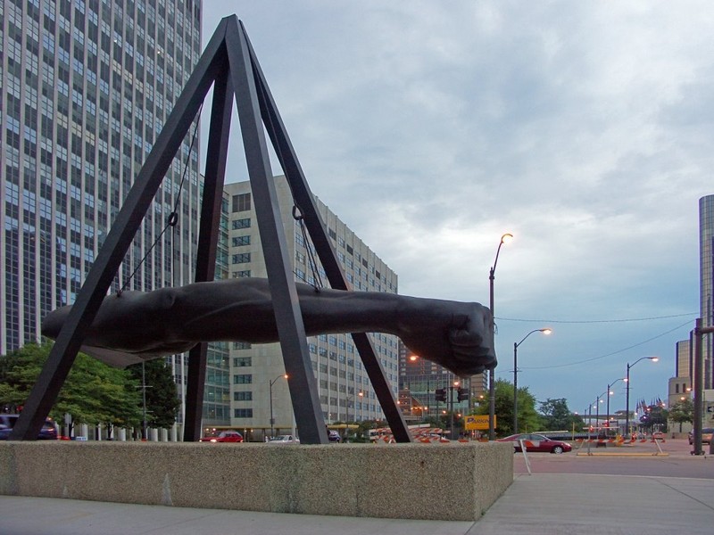 It represents the power of Joe Louis' punch both inside and outside the ring. Because of his efforts to fight Jim Crow laws, the fist was symbolically aimed toward racial injustice.