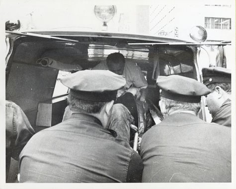 Warhol being lifted into an ambulance after being shot