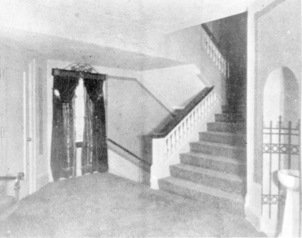 1926. The mezzanine area on the alley side of the theatre. Note the balusters on stairs, the window, and the water fountain.