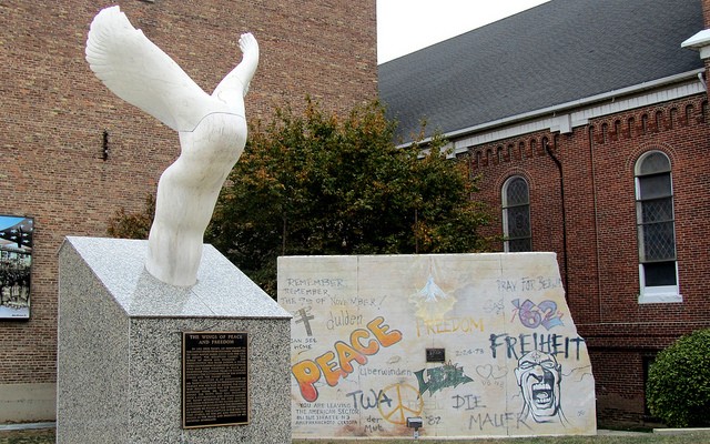 Wings of Peace and Freedom Sculpture and a replica of the Berlin Wall
