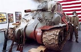 One of many museum exhibits that incorporate authentic weapons and equipment into the display